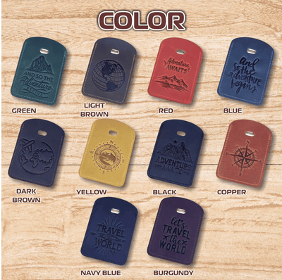 A color-options display for embossed leather travel tags or dog tags on a wood background, with the word COLOR at the top. Each tag shows a different color and sample phrase, labeled Green, Light Brown, Red, Blue, Dark Brown, Yellow, Black, Copper, Navy Blue, and Burgundy.